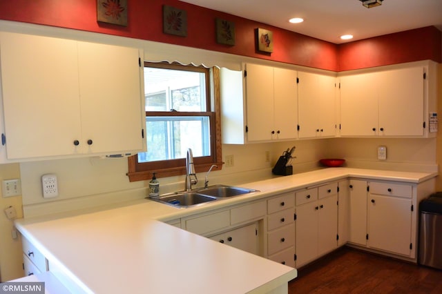 kitchen featuring dark wood-style floors, light countertops, recessed lighting, and a sink
