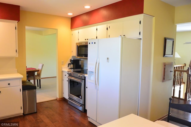 kitchen with white cabinetry, recessed lighting, dark wood finished floors, and appliances with stainless steel finishes