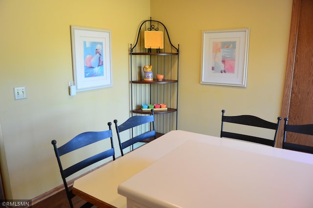 dining area featuring baseboards