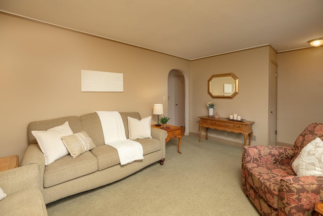 living room featuring arched walkways and carpet flooring
