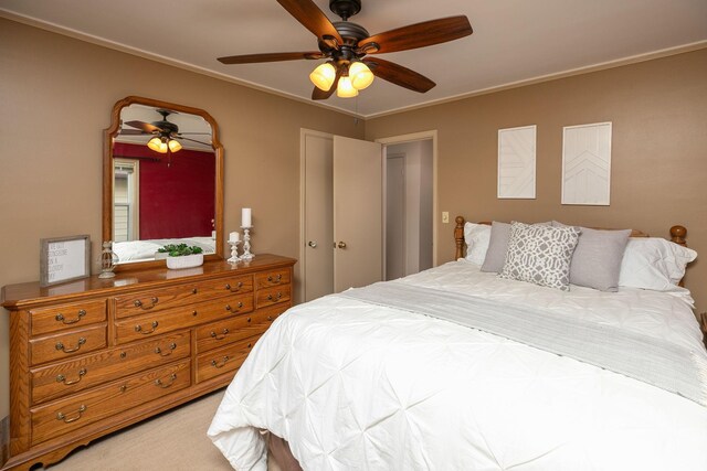 bedroom featuring a ceiling fan and ornamental molding