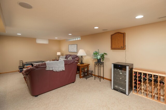 living room featuring beverage cooler, recessed lighting, carpet, and baseboards