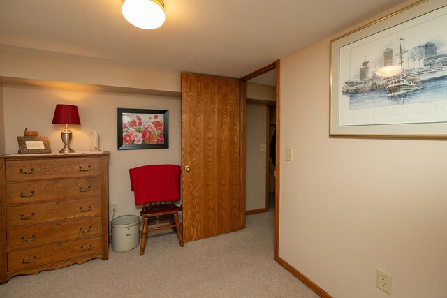 living area featuring carpet