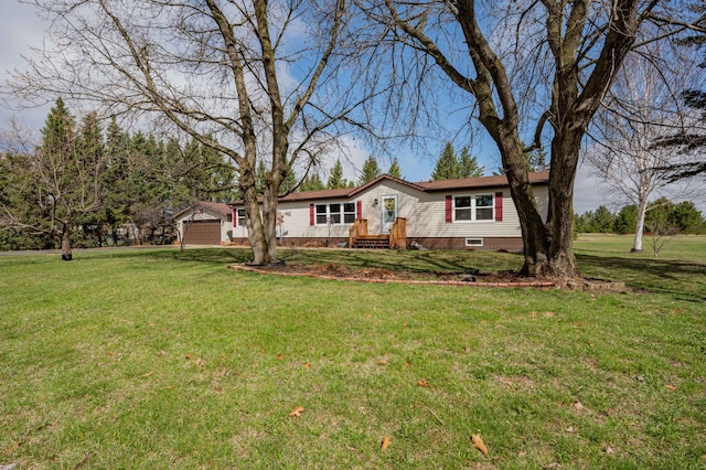 2765 Fraser St, La Prairie, MN 55744 - manufactured / mobile home with a garage and a front lawn
