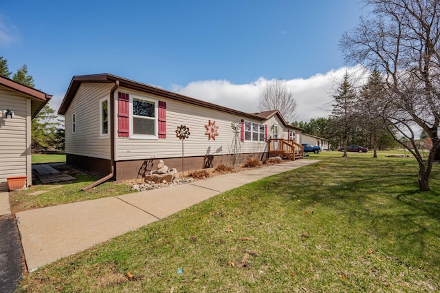 2765 Fraser St, La Prairie, MN 55744 - view of side of home with a yard