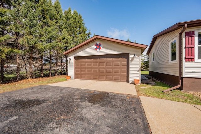 2765 Fraser St, La Prairie, MN 55744 - view of front of home with a detached garage and an outbuilding