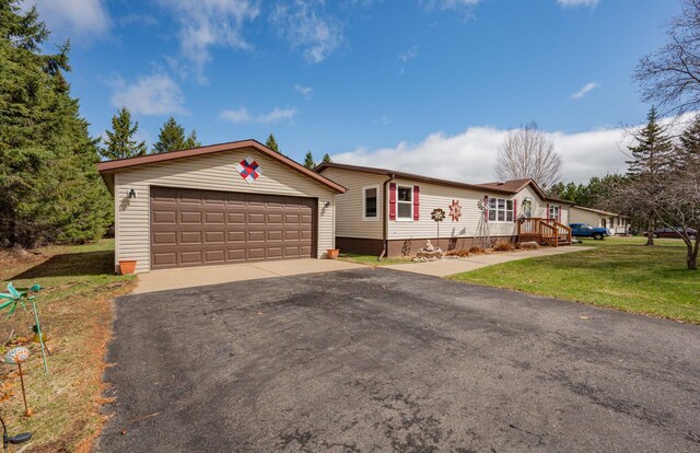 2765 Fraser St, La Prairie, MN 55744 - ranch-style house featuring an outdoor structure, a garage, crawl space, and a front yard