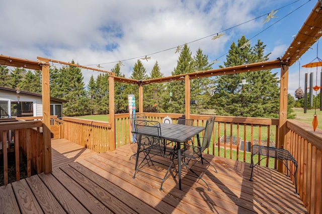 2765 Fraser St, La Prairie, MN 55744 - deck with a lawn and outdoor dining space