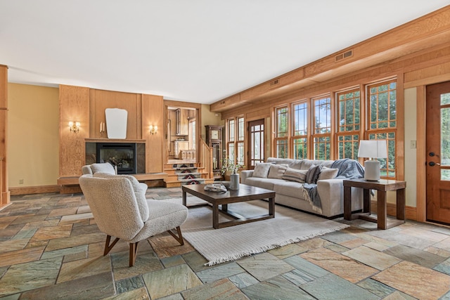 636 County Road B E, Maplewood, MN 55117 - living area featuring stone tile flooring and a glass covered fireplace