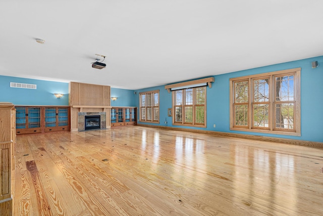 636 County Road B E, Maplewood, MN 55117 - unfurnished living room with wood finished floors and a fireplace