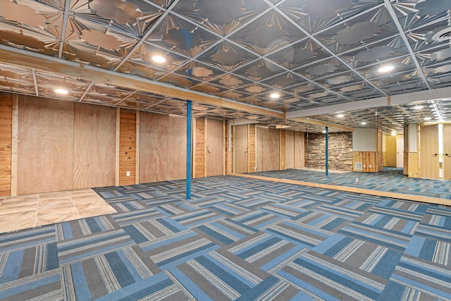 636 County Road B E, Maplewood, MN 55117 - finished basement with wood walls, carpet, and recessed lighting