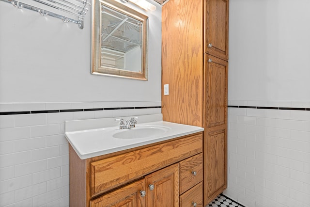 636 County Road B E, Maplewood, MN 55117 - bathroom with tile walls, vanity, and a wainscoted wall
