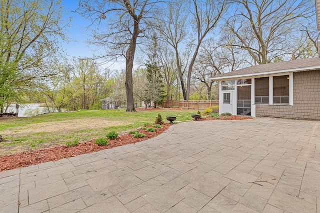 636 County Road B E, Maplewood, MN 55117 - fenced backyard featuring a sunroom and a patio