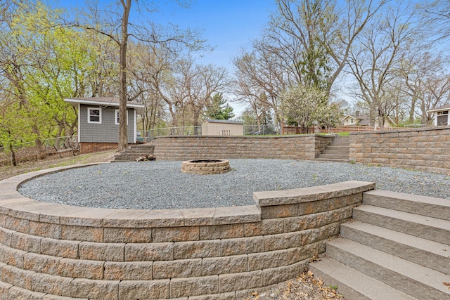 636 County Road B E, Maplewood, MN 55117 - view of yard with an outdoor fire pit, an outdoor structure, and a patio area