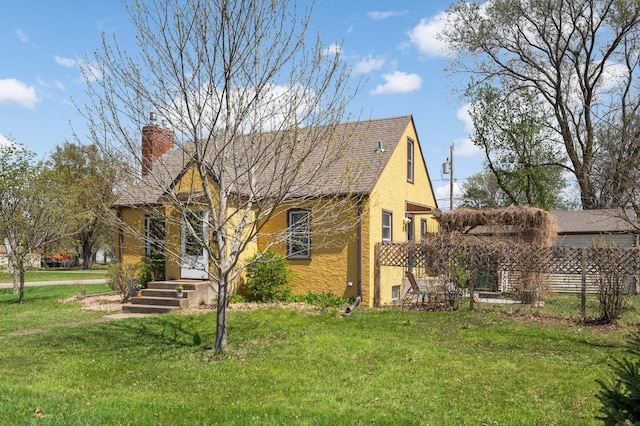 1100 Summit Ave, Saint Paul Park, MN 55071 - view of front of property with stucco siding, a chimney, and a front yard