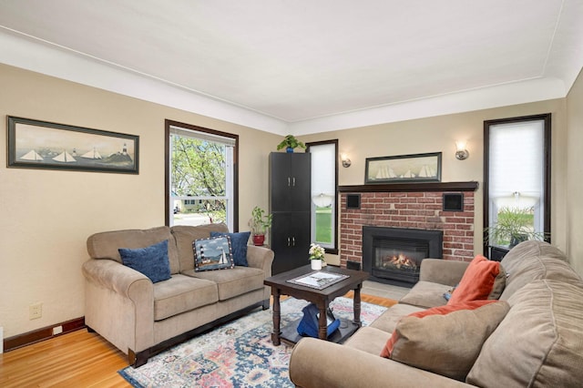1100 Summit Ave, Saint Paul Park, MN 55071 - living room with light wood-style flooring, baseboards, and a fireplace