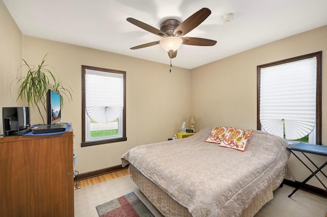 1100 Summit Ave, Saint Paul Park, MN 55071 - bedroom with light wood-type flooring, baseboards, and ceiling fan
