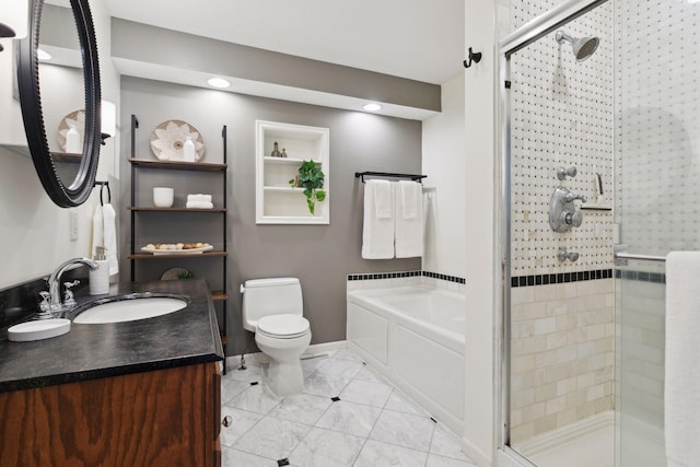 full bath with vanity, a garden tub, toilet, and a shower stall