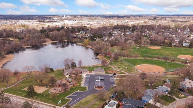 drone / aerial view featuring a water view and a residential view
