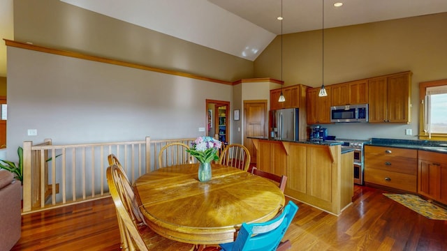 dining area featuring high vaulted ceiling and dark wood-type flooring