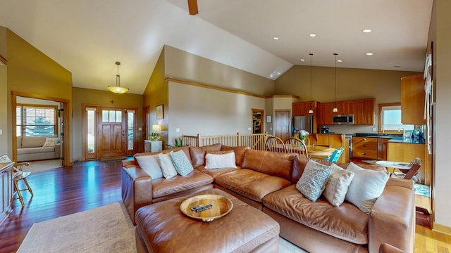 living room featuring recessed lighting, high vaulted ceiling, and wood finished floors