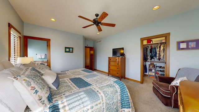 carpeted bedroom featuring a walk in closet, a ceiling fan, a closet, and recessed lighting