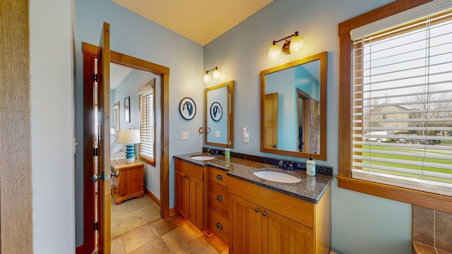 bathroom with double vanity and a sink