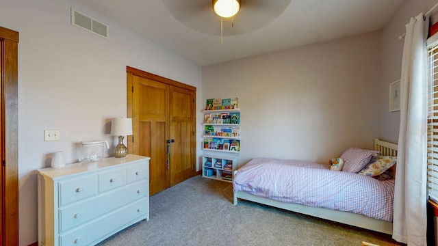bedroom featuring visible vents, carpet flooring, and ceiling fan
