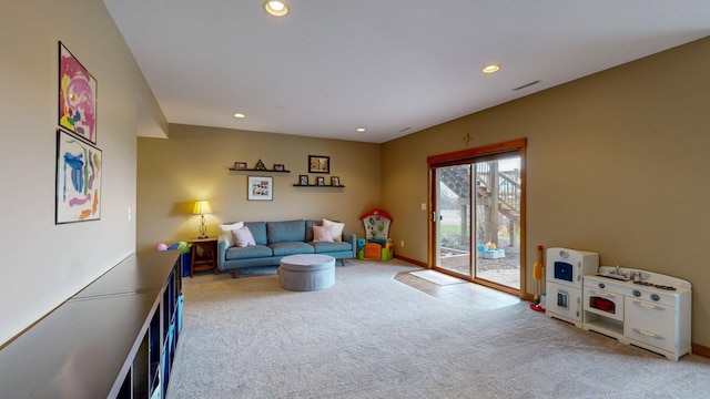 carpeted living area with recessed lighting