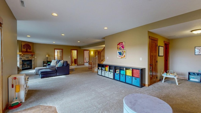 recreation room featuring visible vents, a fireplace, carpet floors, baseboards, and recessed lighting