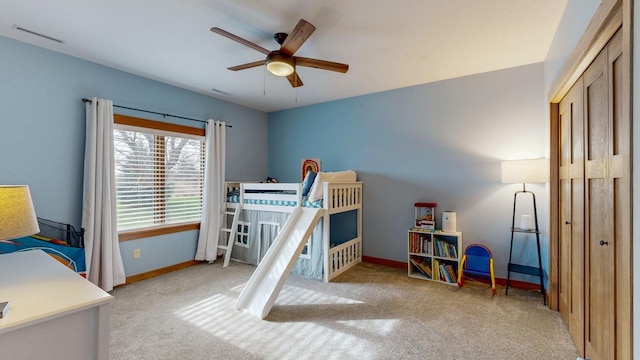carpeted bedroom with visible vents and baseboards