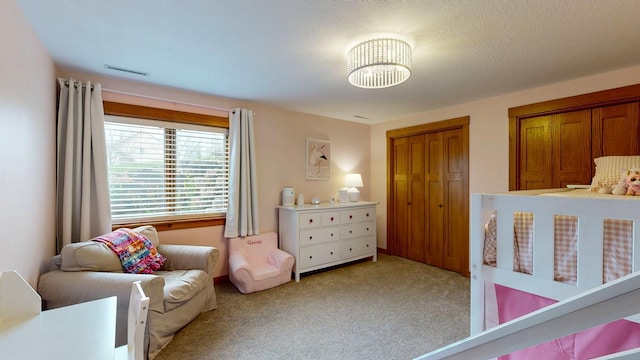 bedroom with light carpet and visible vents