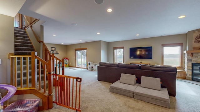 living room with recessed lighting, light carpet, and plenty of natural light