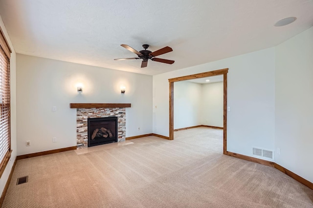 unfurnished living room featuring light colored carpet, ceiling fan, and visible vents