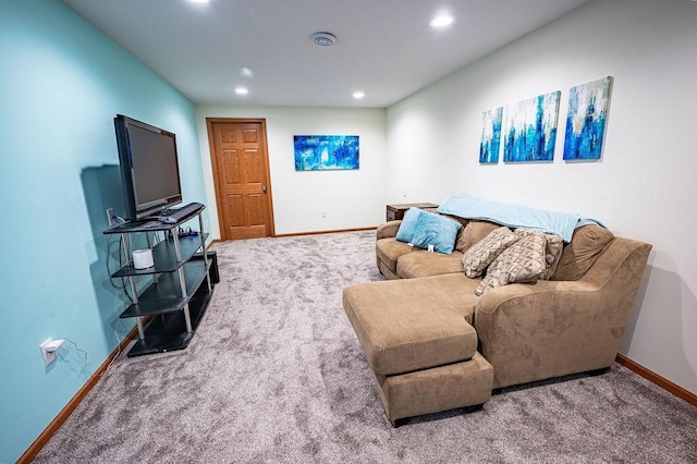 carpeted living area with baseboards and recessed lighting