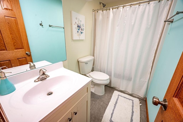 full bath featuring toilet, tile patterned floors, and vanity