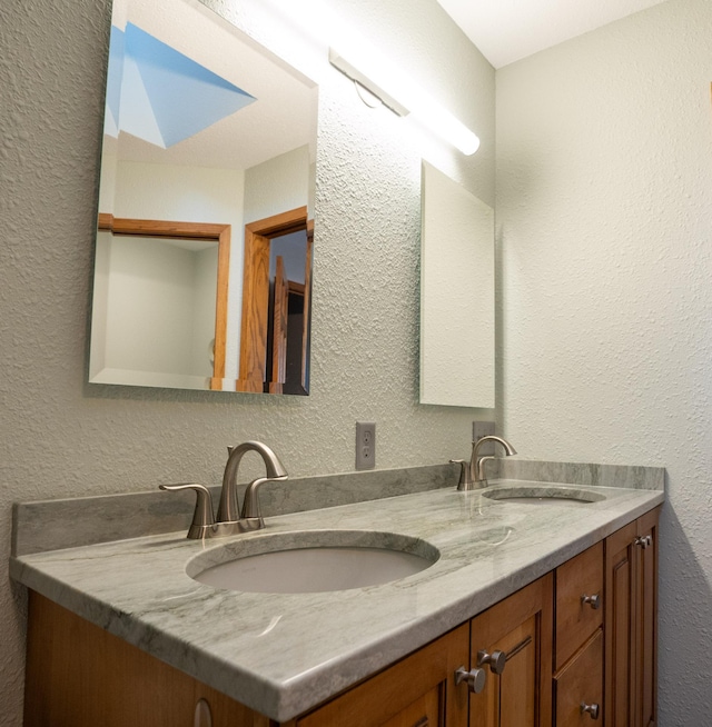 35873 Drumbeater Rd, Cohasset, MN 55721 - bathroom with a textured wall and double vanity