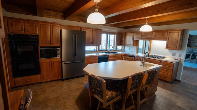 35873 Drumbeater Rd, Cohasset, MN 55721 - kitchen featuring black appliances, beam ceiling, a sink, brown cabinetry, and light countertops