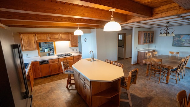 35873 Drumbeater Rd, Cohasset, MN 55721 - kitchen featuring brown cabinetry, a breakfast bar area, light countertops, an island with sink, and beamed ceiling