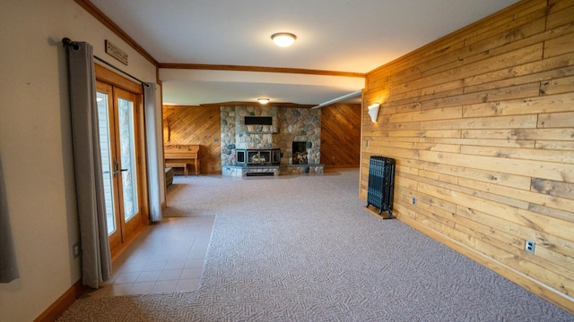 35873 Drumbeater Rd, Cohasset, MN 55721 - living room with wooden walls, a stone fireplace, ornamental molding, plenty of natural light, and carpet flooring