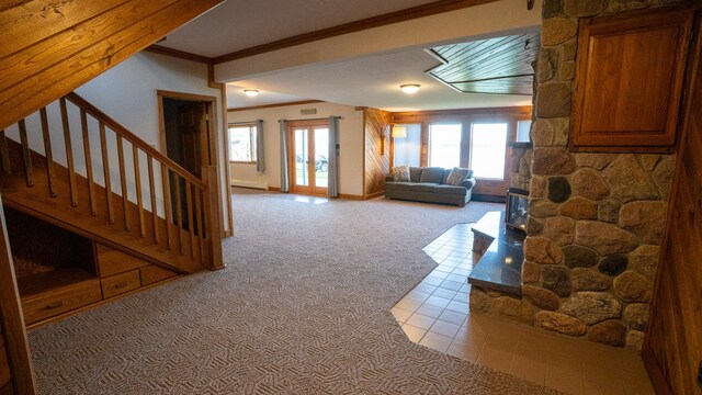 35873 Drumbeater Rd, Cohasset, MN 55721 - living area featuring light carpet, stairway, ornamental molding, baseboard heating, and light tile patterned floors