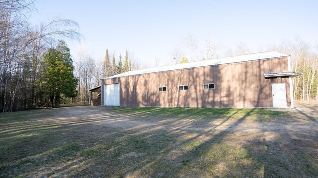 35873 Drumbeater Rd, Cohasset, MN 55721 - view of outbuilding with dirt driveway and an outdoor structure