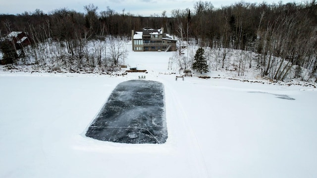 35873 Drumbeater Rd, Cohasset, MN 55721 - snowy aerial view with a forest view
