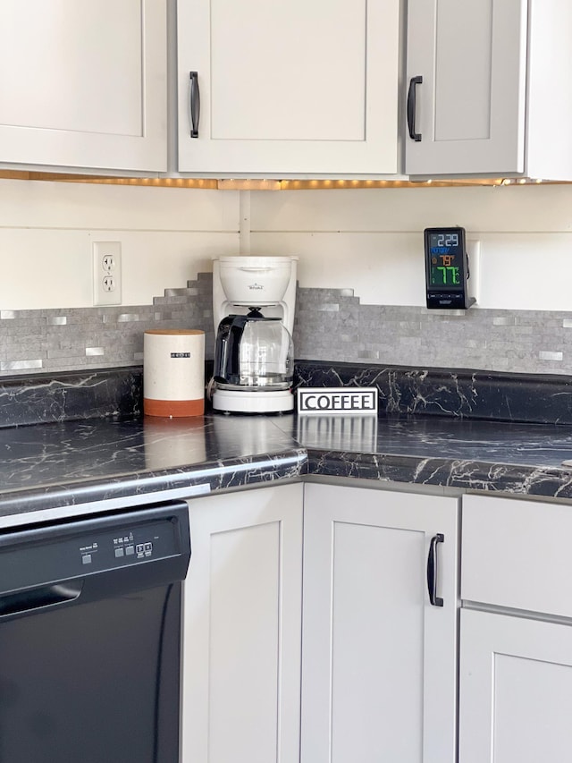 kitchen with dishwasher, white cabinets, and tasteful backsplash