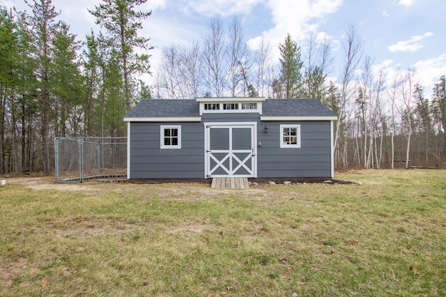 view of shed with fence
