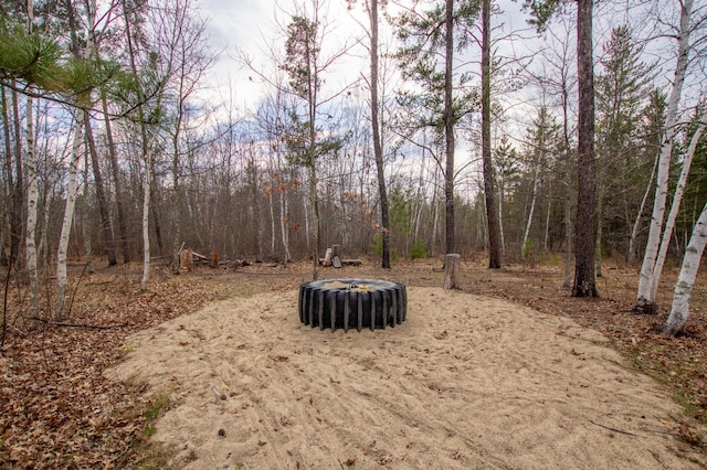 view of yard featuring a wooded view