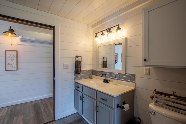 29133 Neighborly Dr, Laporte, MN 56461 - half bath with vanity, wood finished floors, and wood walls