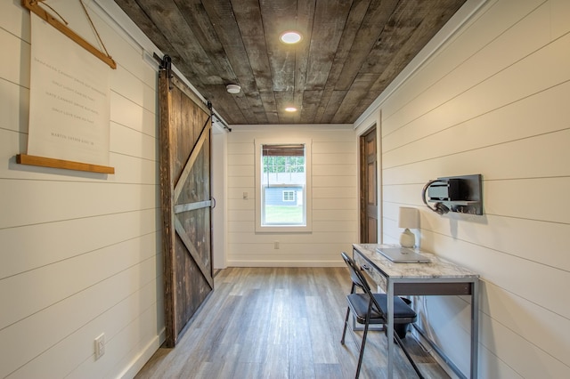 29133 Neighborly Dr, Laporte, MN 56461 - entryway with a barn door, wood finished floors, wood walls, recessed lighting, and wooden ceiling