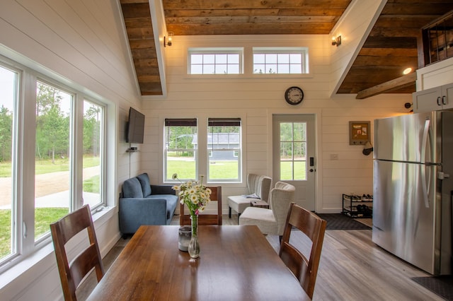 29133 Neighborly Dr, Laporte, MN 56461 - dining area with plenty of natural light, wooden walls, wood finished floors, and wood ceiling