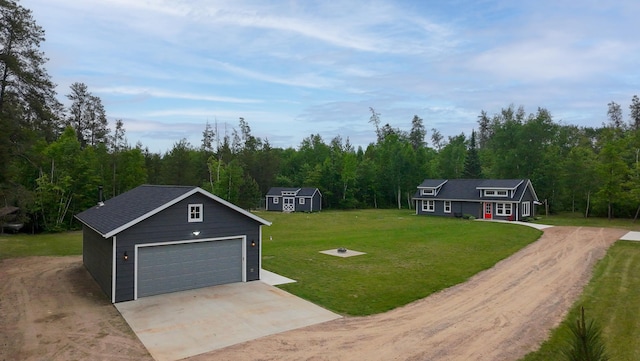 29133 Neighborly Dr, Laporte, MN 56461 - view of grassy yard featuring an outdoor structure, a forest view, and dirt driveway